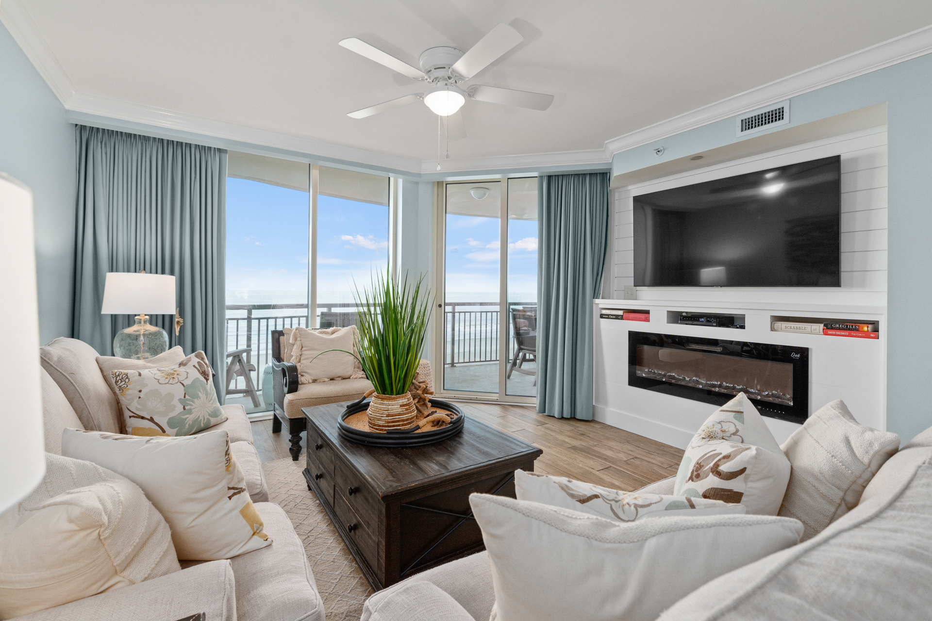 Cozy oceanfront condo living room with fireplace and modern amenities in North Myrtle Beach, SC.