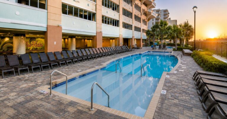 Outdoor pool and lounge chairs on the Mar Vista Grande pool deck